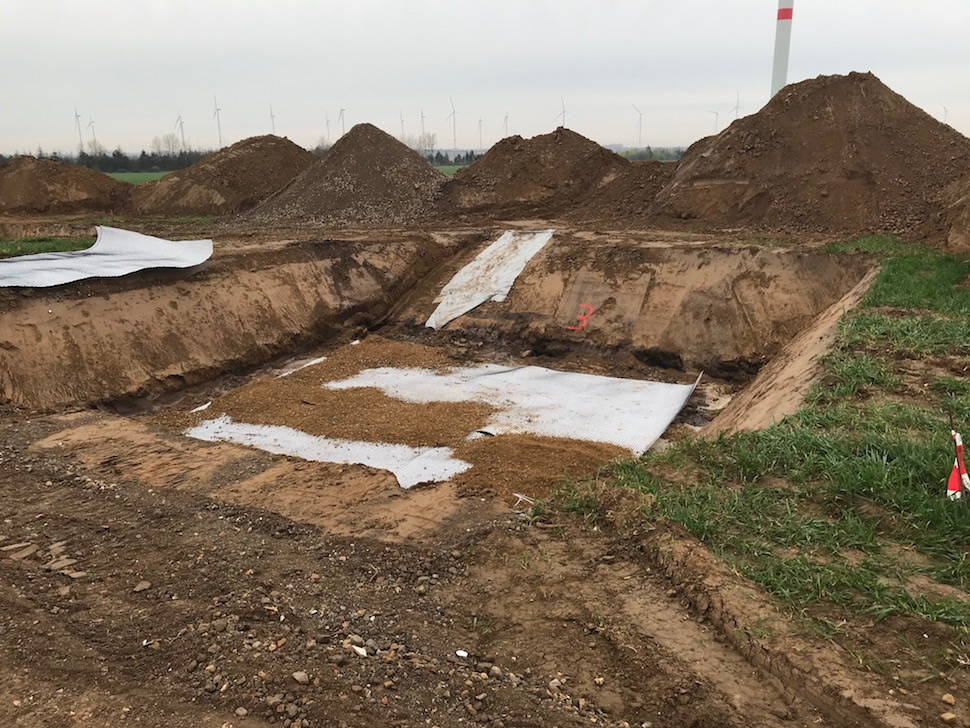 wide white rolls lying along the mounds